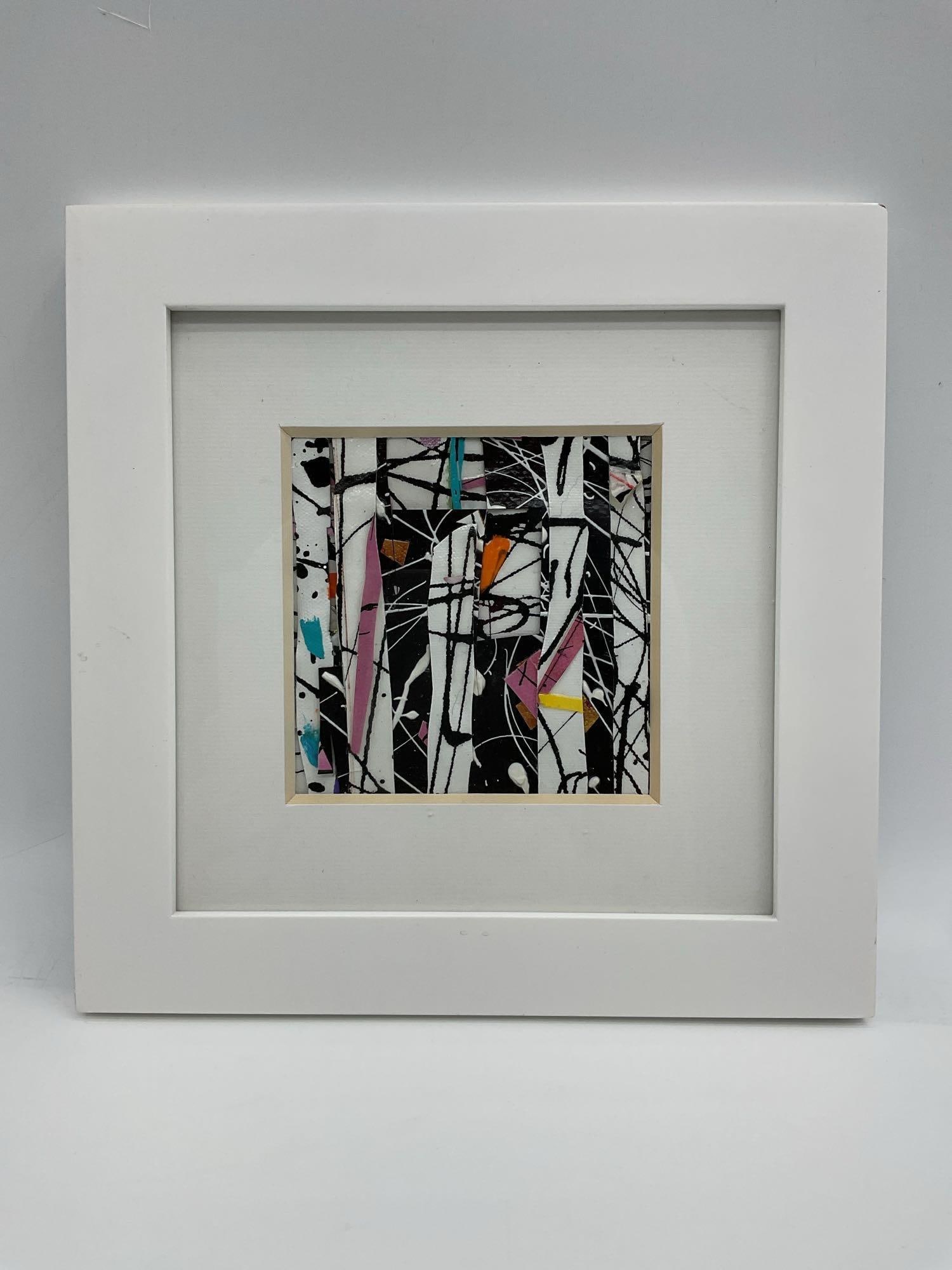 Abstract Mixed-Media Miniature in White Frame: Small abstract artwork featuring splattered black lines and geometric color blocks in pink, orange, teal, and gold on a textured surface. Energetic and modern aesthetic, presented in a crisp white mat