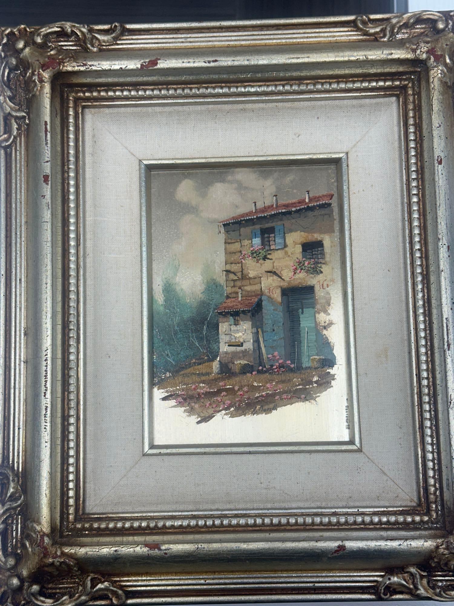 Borelli 5x7 Oil Painting on Silver Panel: Small oil painting by Borelli depicting a rustic stone house with red tile roof and surrounding greenery. Painted on silver-toned panel and framed in ornate silver frame.Medium: Oil on silver panelDim