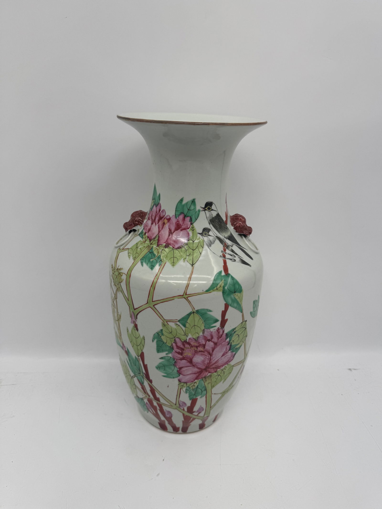 Chinese Famille Rose Porcelain Vase, Floral & Bird Decor: Description: A Chinese porcelain vase decorated in the Famille Rose palette. The vase features floral and bird motifs, with calligraphy on one side. The base color is white. The vase has a flared rim