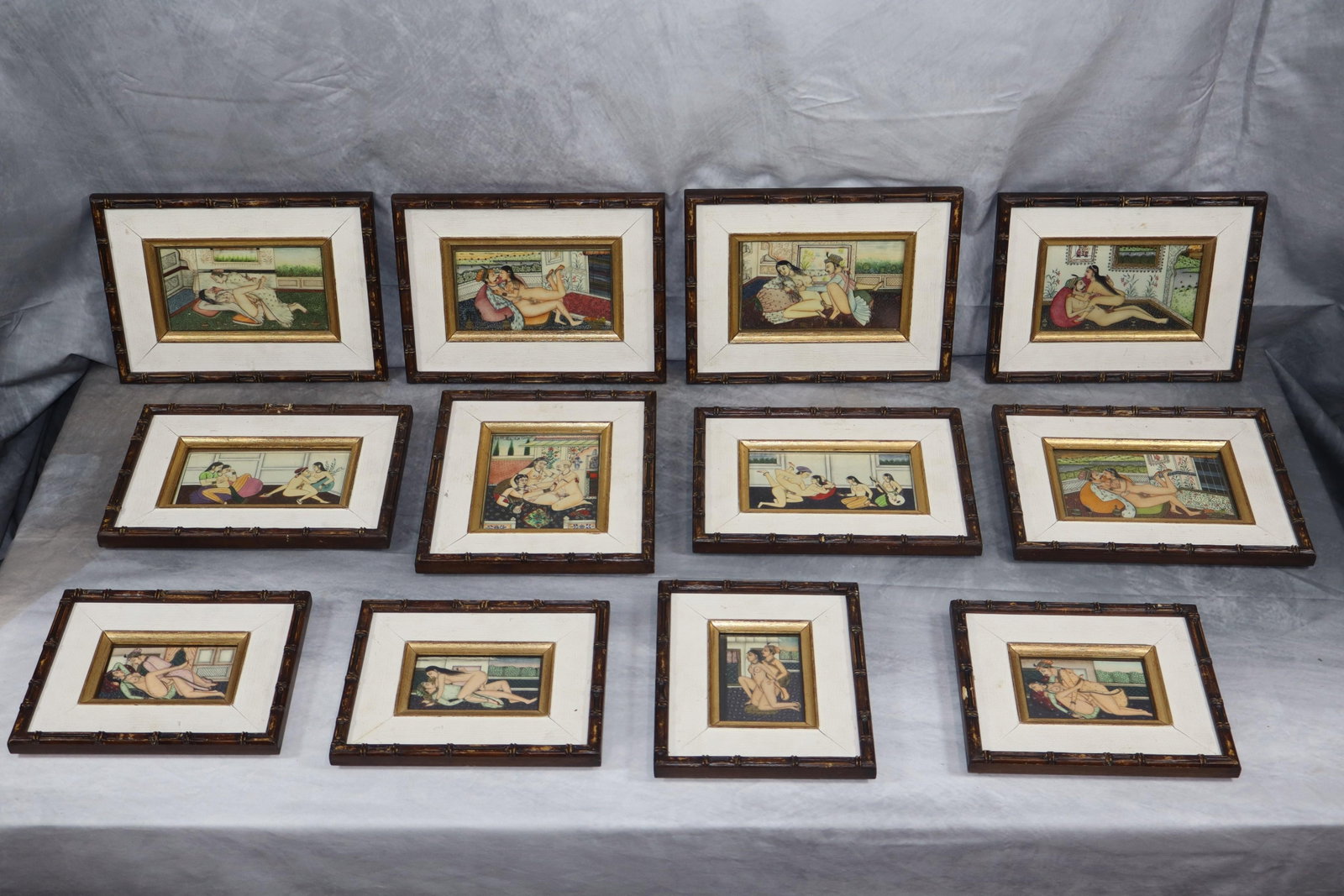 Set of 12 Indian Mughal Miniature Kama Sutra Panel Painting: This is a set of 12 framed Indian Mughal miniature paintings, each depicting erotic scenes inspired by the Kama Sutra. These hand-painted artworks are meticulously detailed and reflect traditional Mug