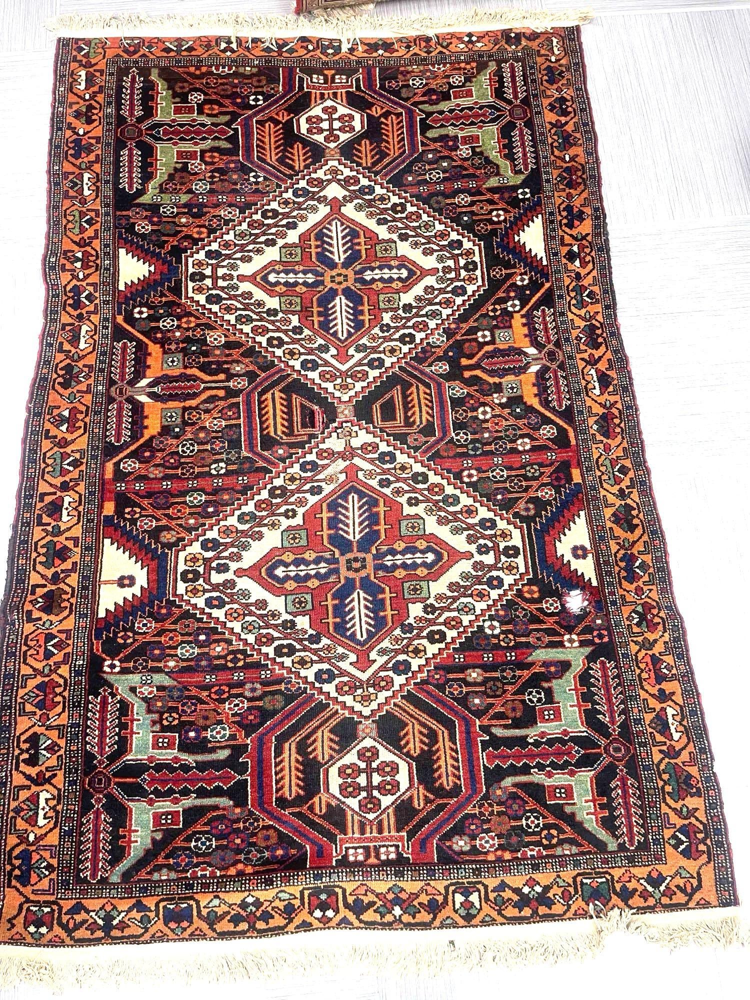 Turkish Wool Rug: Wool rug.Dimensions: L7ft W4ft - Has a hole on bottom right and a repair