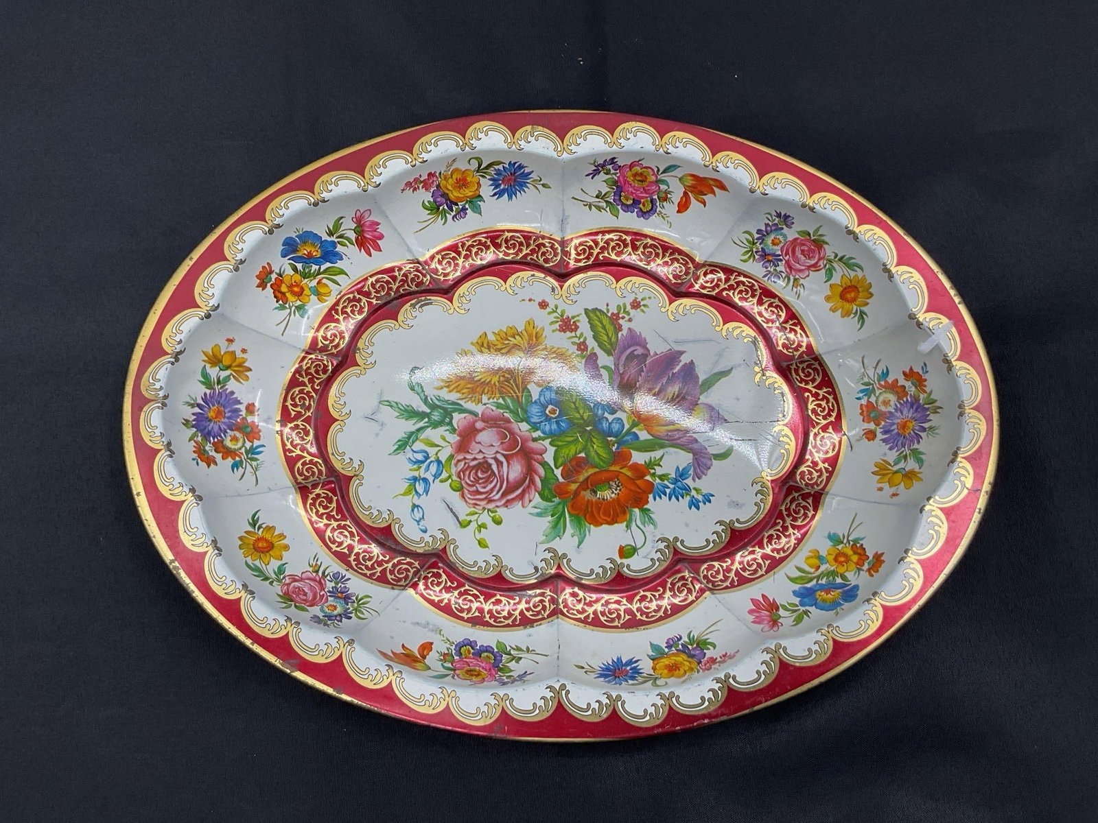 Vintage Floral Embossed Divided Serving Platter with Gilded Trim: Vibrant oval porcelain divided platter featuring ornate multicolor floral patterns, embossed scalloped sections, and rich burgundy and gold scroll accents. Central bouquet design surrounded by repeati