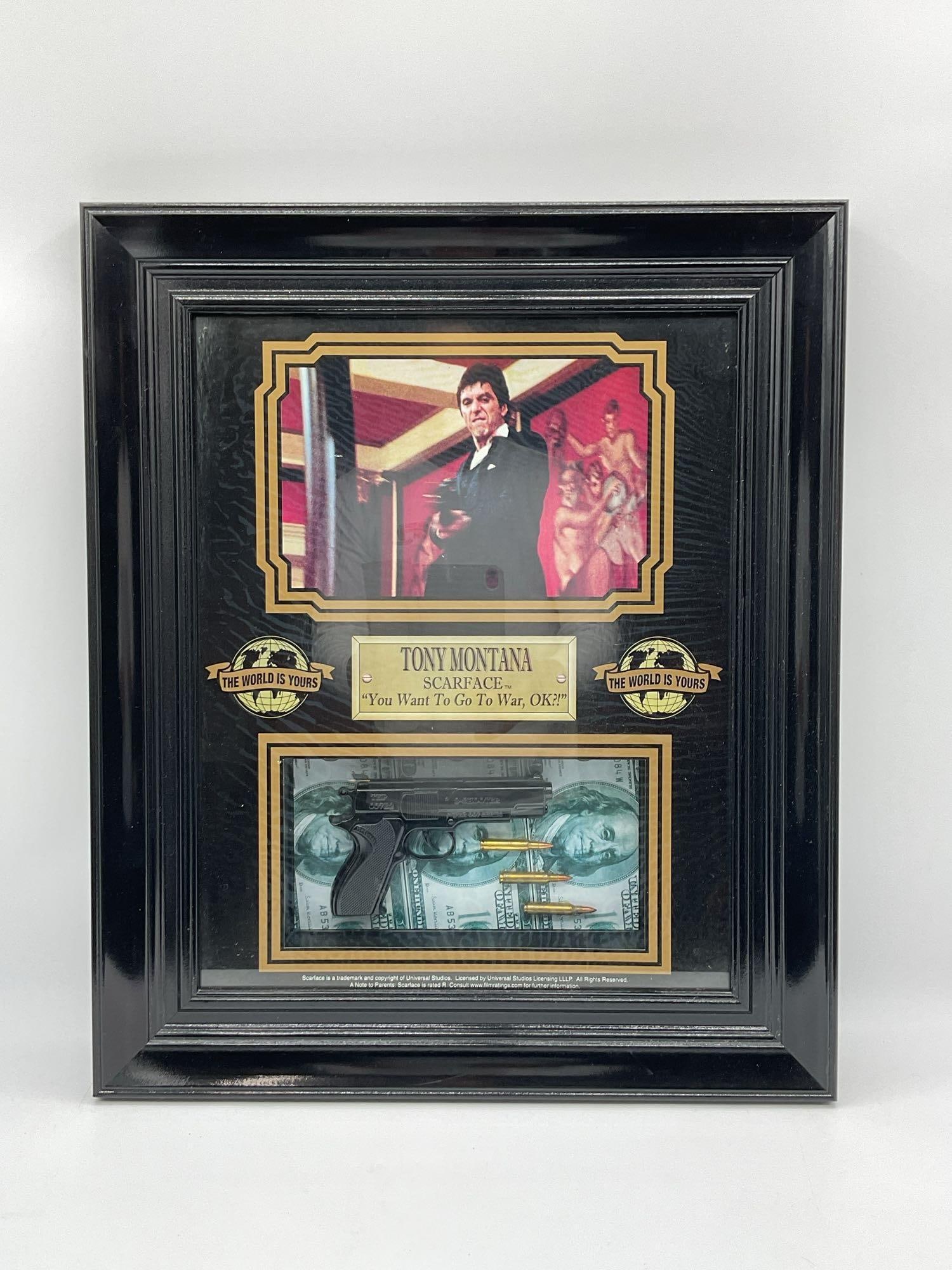 Tony Montana Scarface Movie Display: Framed collectible display featuring an image of Tony Montana from the 1983 film Scarface, holding a gun in one of the movie’s most iconic scenes. Below the image is a plaque with the quote You