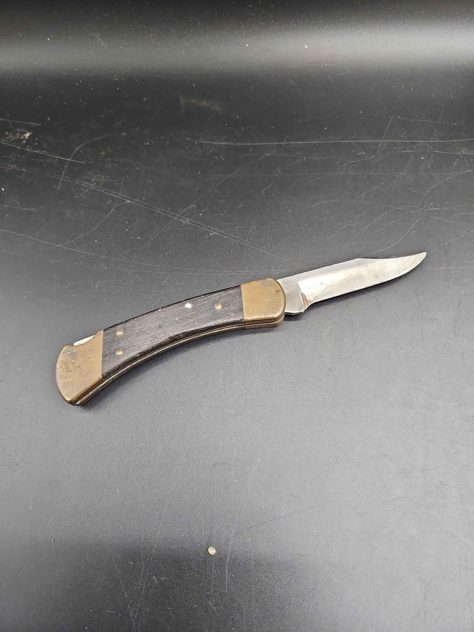 Buck 110 Folding Hunter Knife with Brass Bolsters and Wood Inlay (1 of 4)