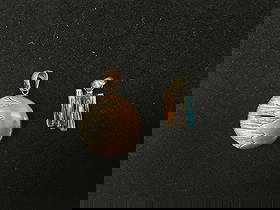 Two Sterling Silver 925 Pendants – Abstract Dome & Multi-Gem Bar Designs, 13.28g: Lot of two unique sterling silver pendants, stamped 925, with a combined weight of 13.28 grams. One pendant features a bold abstract dome design with contrasting textured silver and warm bronze-li