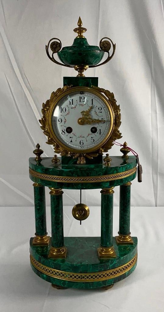 19th Century Malachite and Bronze Cock: 19th century malachite clock adorned with doree bronze ormolu. Dimensions: H:18in L:8in W:4in approximately