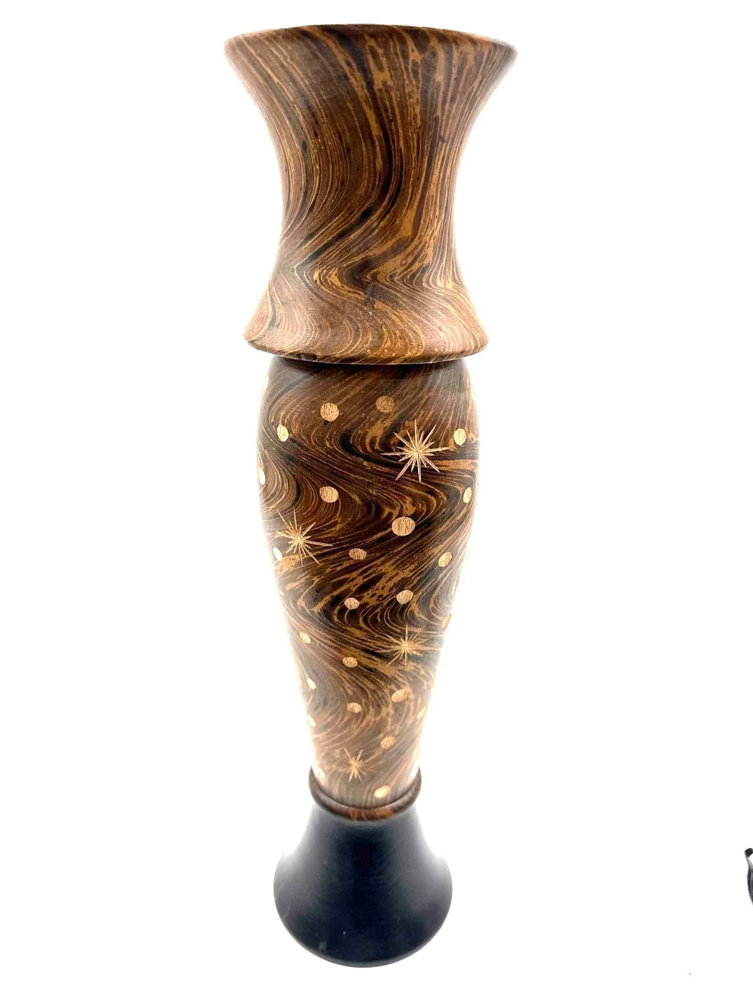 Hand-Carved Coconut Wood Decorative Vase: Tall decorative vase made from polished coconut wood featuring natural swirling grain patterns and etched starburst and dot motifs. The flared rim and contrasting dark base create a sculptural silhoue