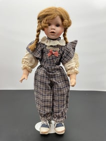 Porcelain Doll in Plaid Overalls with Pigtails
