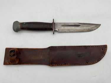 Vintage Fixed Blade Hunting Knife with Leather Sheath Steel, wood, and leather