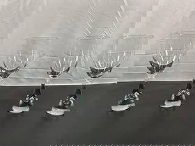 Holmegaard Princess Schnapps/Wine Glasses by Bent O. Severin (Set of 4) - Danish: This set of four elegant Orrefors crystal wine glasses epitomizes Scandinavian minimalism and craftsmanship. Each glass features a sleek, clear crystal design highlighted by a distinctive tapered stem