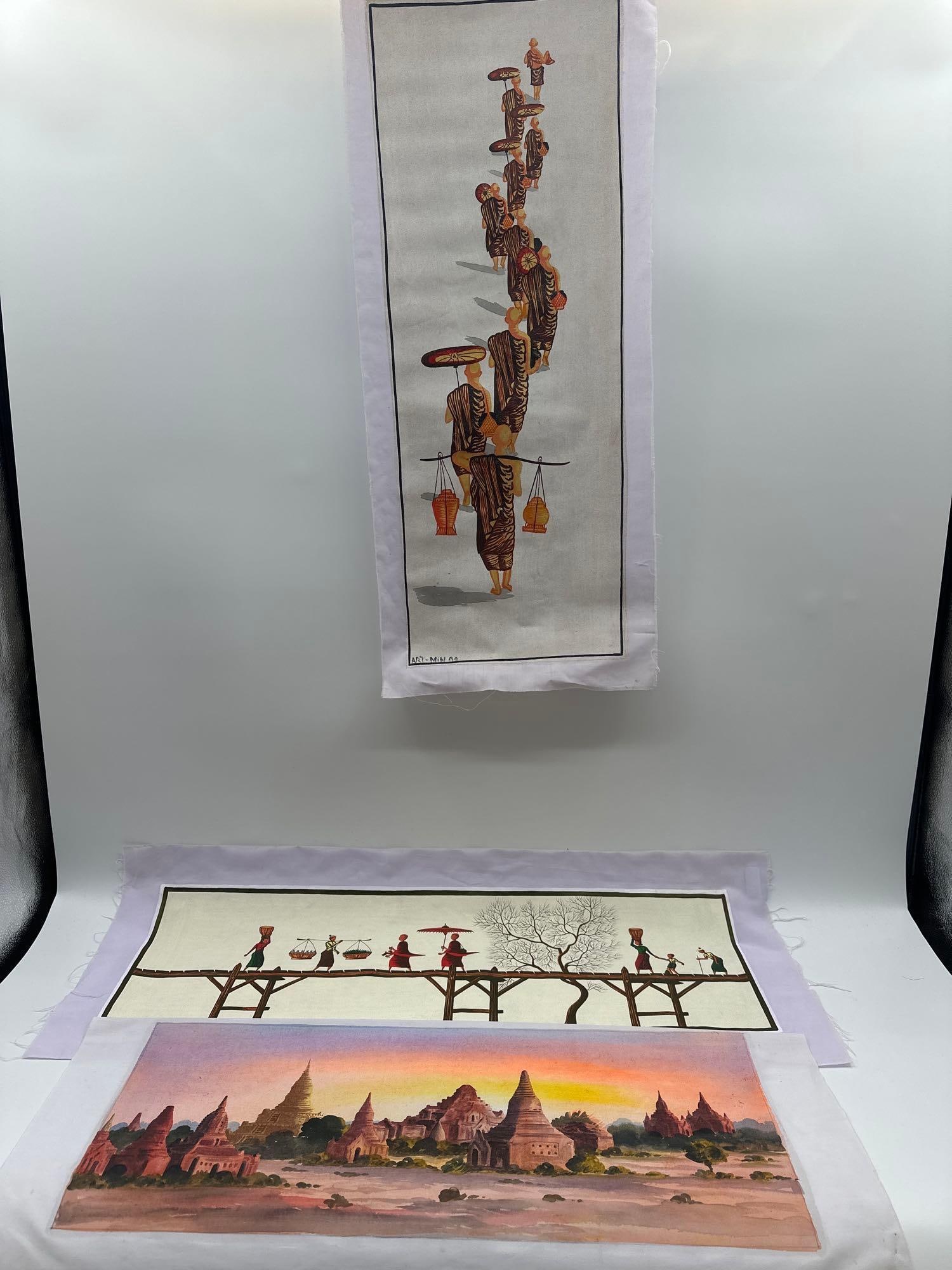 Set of Three Southeast Asian Fabric Paintings: Village Bridge CrossingHorizontal scene of villagers walking across a wooden bridge, carrying baskets and umbrellas. The minimalist design and warm tones reflect daily life in a rural Southeast Asian