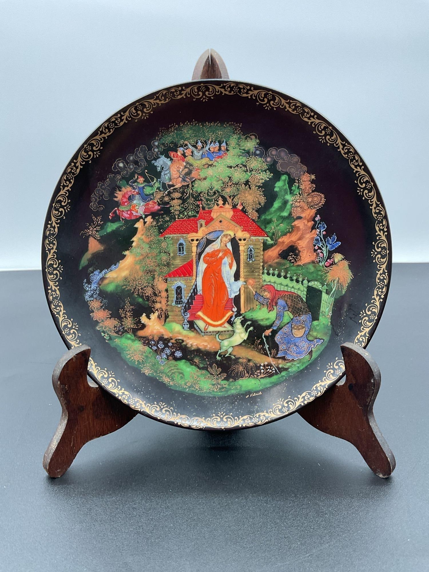 Russian Palekh Collectible Plate (1988): This collectible plate is part of the Palekh series, showcasing traditional Russian miniature artwork inspired by a poem of A.S. Pushkin. The artwork is created by Alexander Kovalev, a well-known Pale