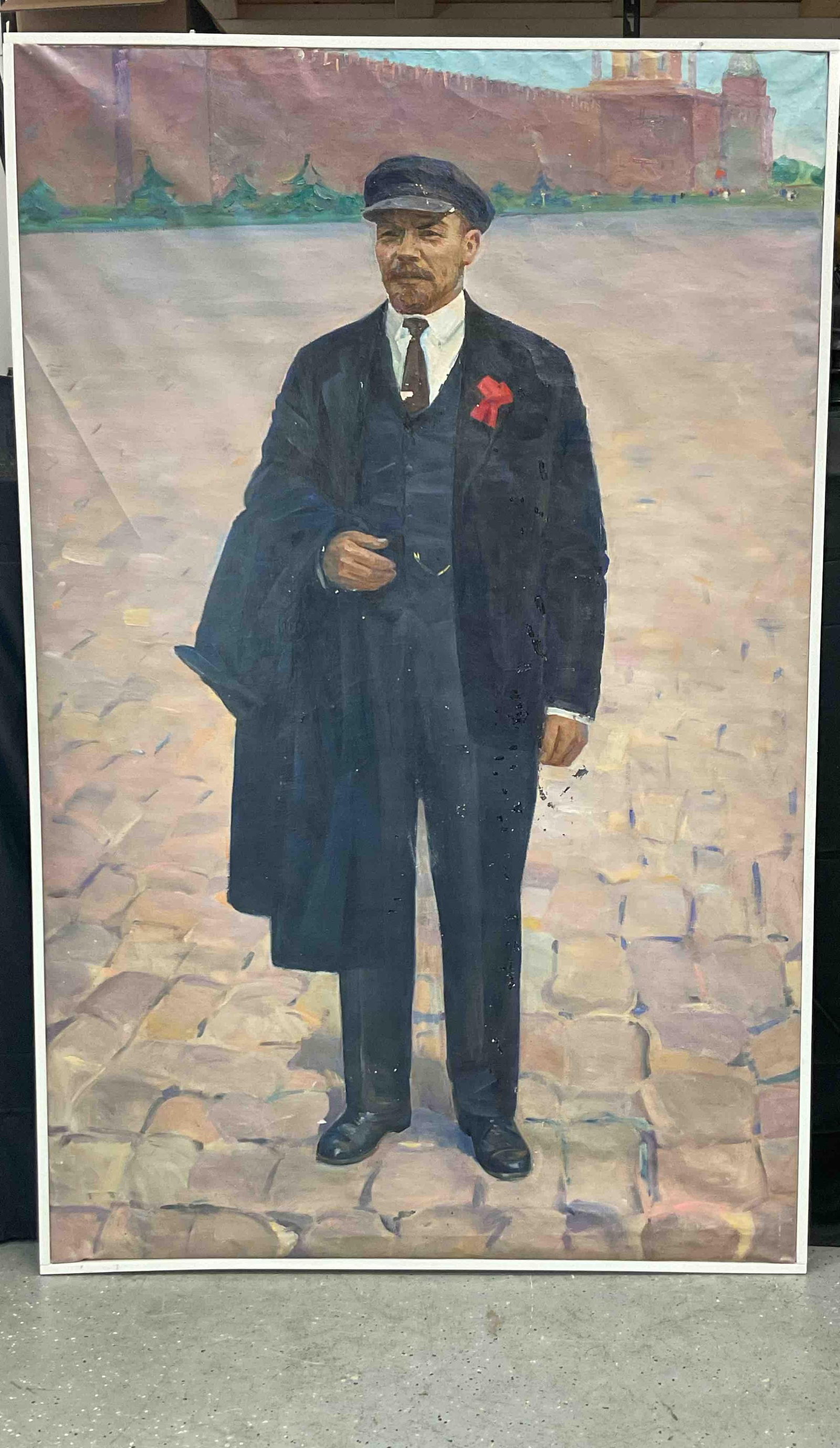 Portrait of Vladimir Lenin in Red Square: Depicts Lenin standing in formal attire with a cap and red ribbon, Red Square in the background Oil on canvas Dimensions: H79in L51in