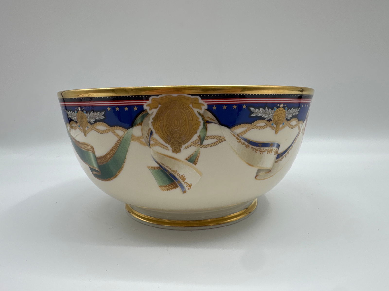 Lenox China American Commemorative Limited Edition Bowl: Lenox Limited Edition bowl commemorating the Millennium in America. The bowl features a design inspired by the official White House china, with cobalt blue, vibrant yellow, and American Federal red ac