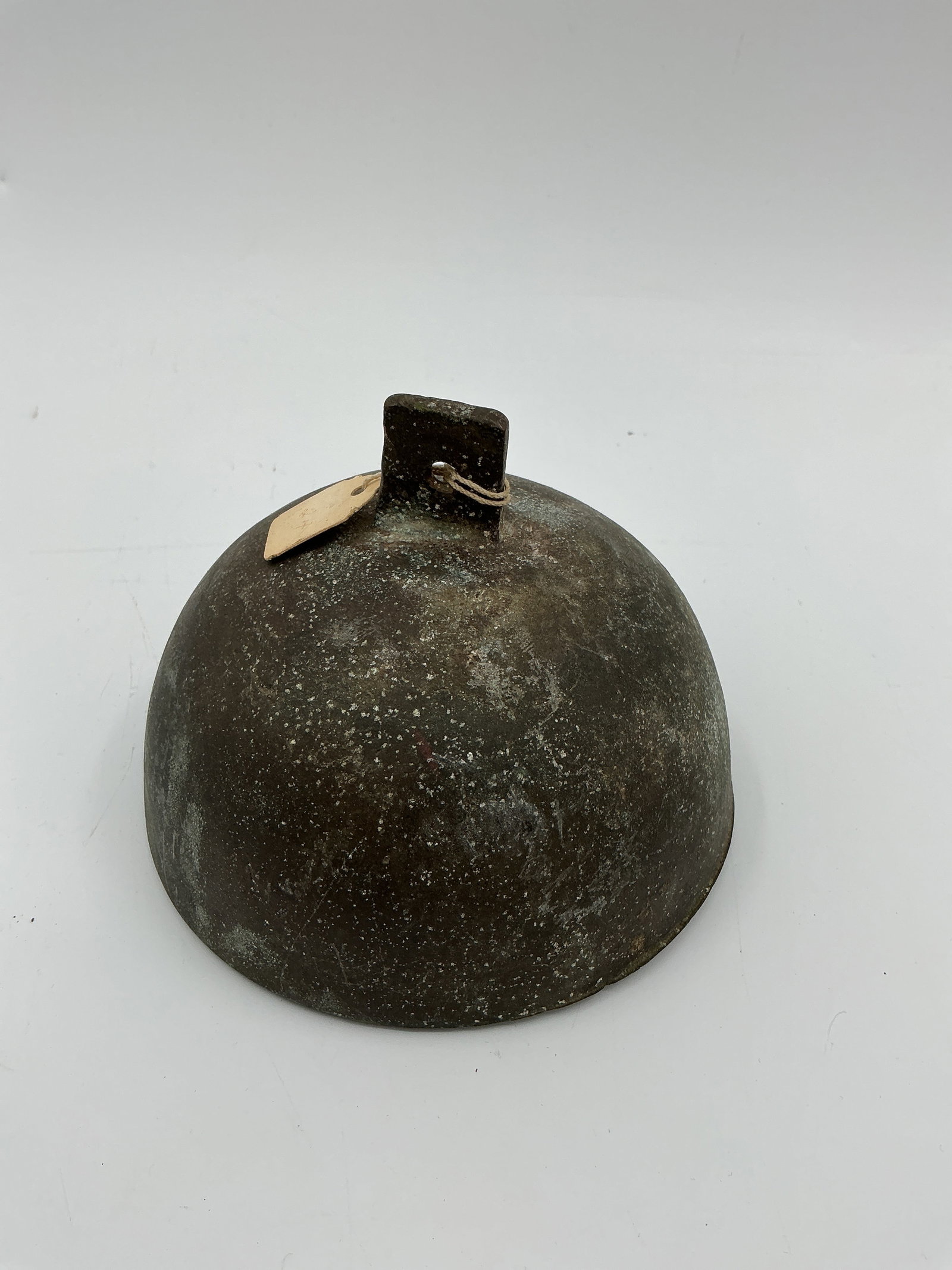 Antique Metal Bell: Antique metal bowl, approximately 5.25 inches in diameter and 4 inches in height. Features a distinctive handle. Patina consistent with age.