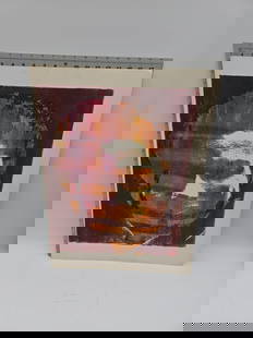 Abstract Portrait Print: Abstract portrait print featuring possibly Huey Newton rendered in shades of red, orange, and purple. Dimensions are approximately 24 x 18 inches.