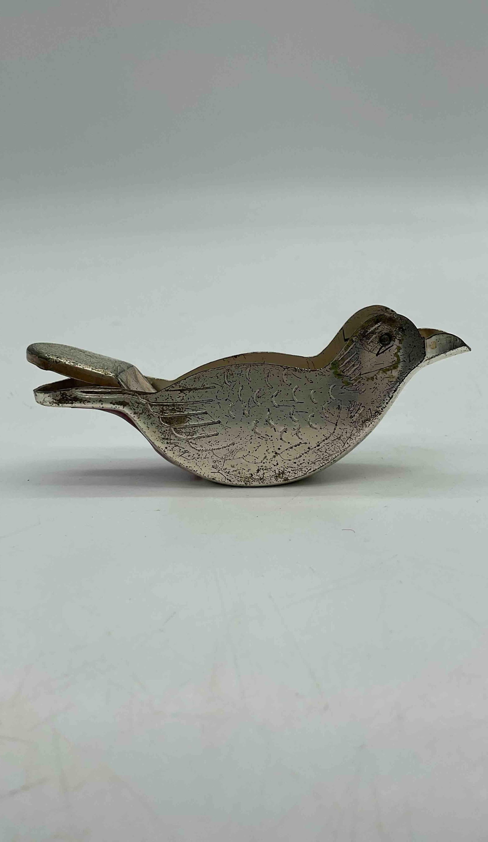 Antique Bird-shaped Lemon Squeezer: Charming small lemon squeezer crafted in the shape of a bird, with hinged design allowing citrus juice to be pressed through the beak. Functional kitchenware and collectible novelty item. MediumCast m