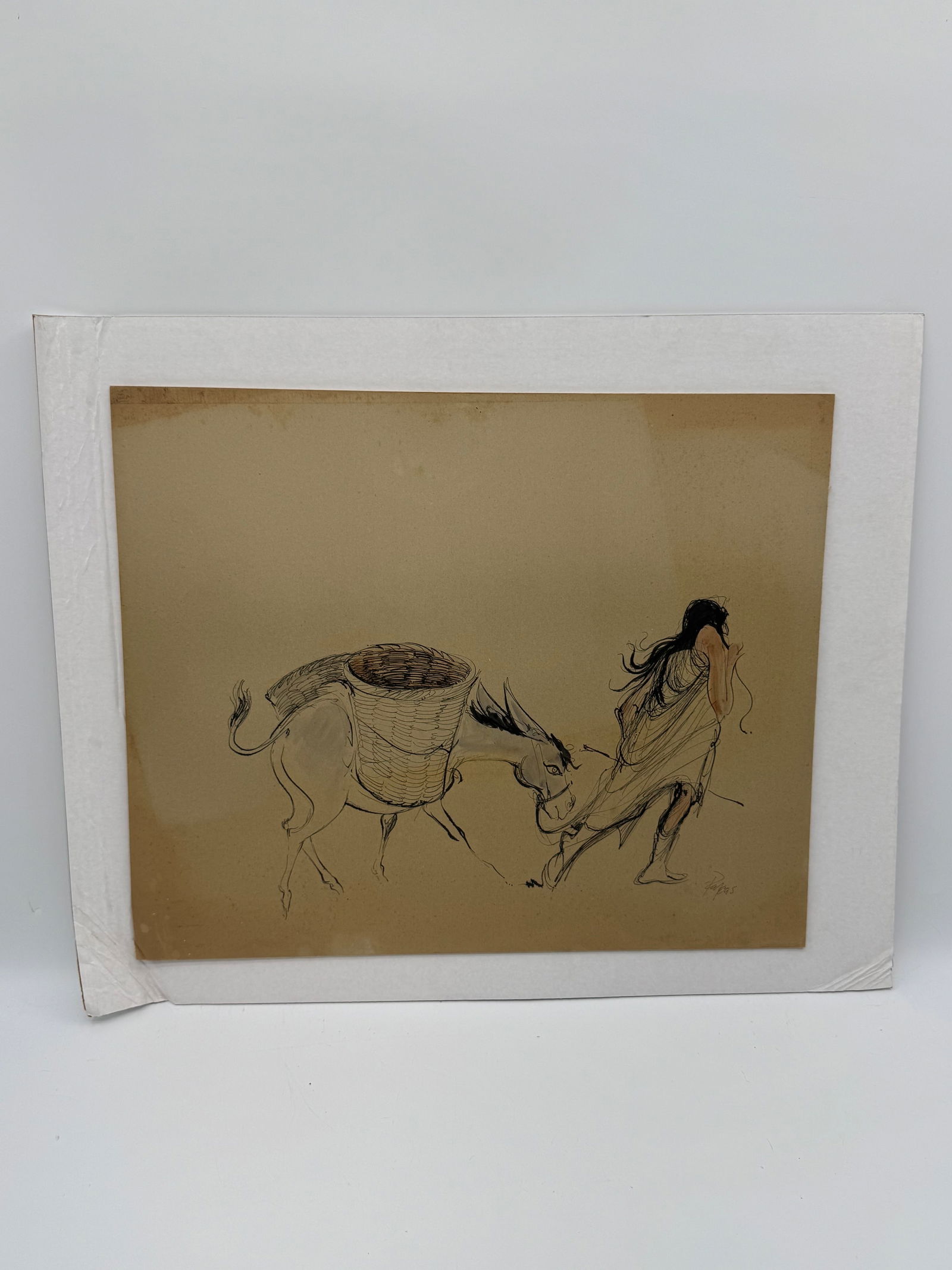 Drawing of Figure with Donkey by Papas: drawing on paper depicting a figure leading a donkey carrying a basket. Image measures 26 x 22 inches.
