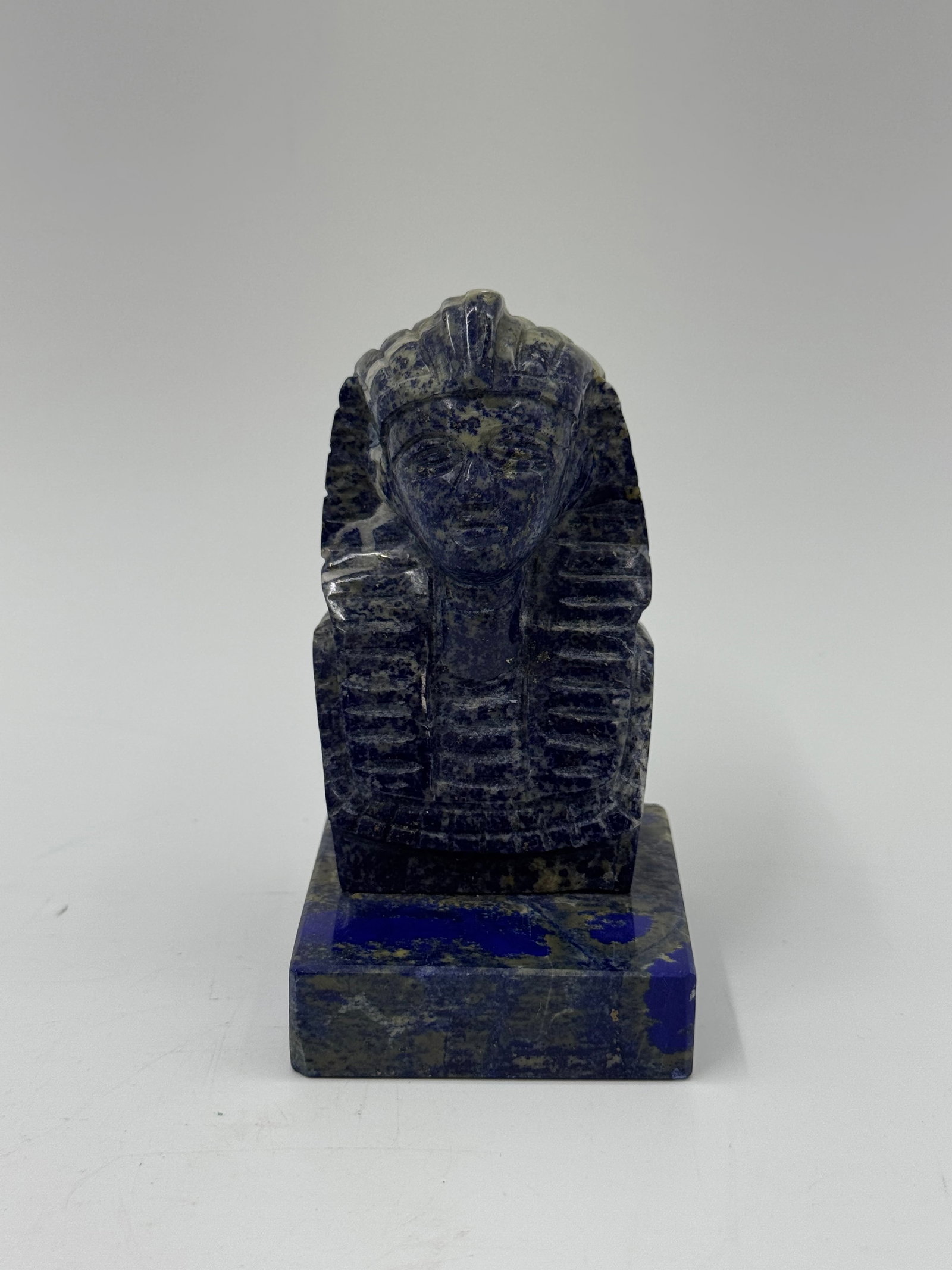 Lapis Lazuli Scarab Beetle Sculpture: A carved lapis lazuli scarab beetle sculpture. The piece features detailed carving and is mounted on a rectangular base. Dimensions approximately 2 x 3 x 4 inches.