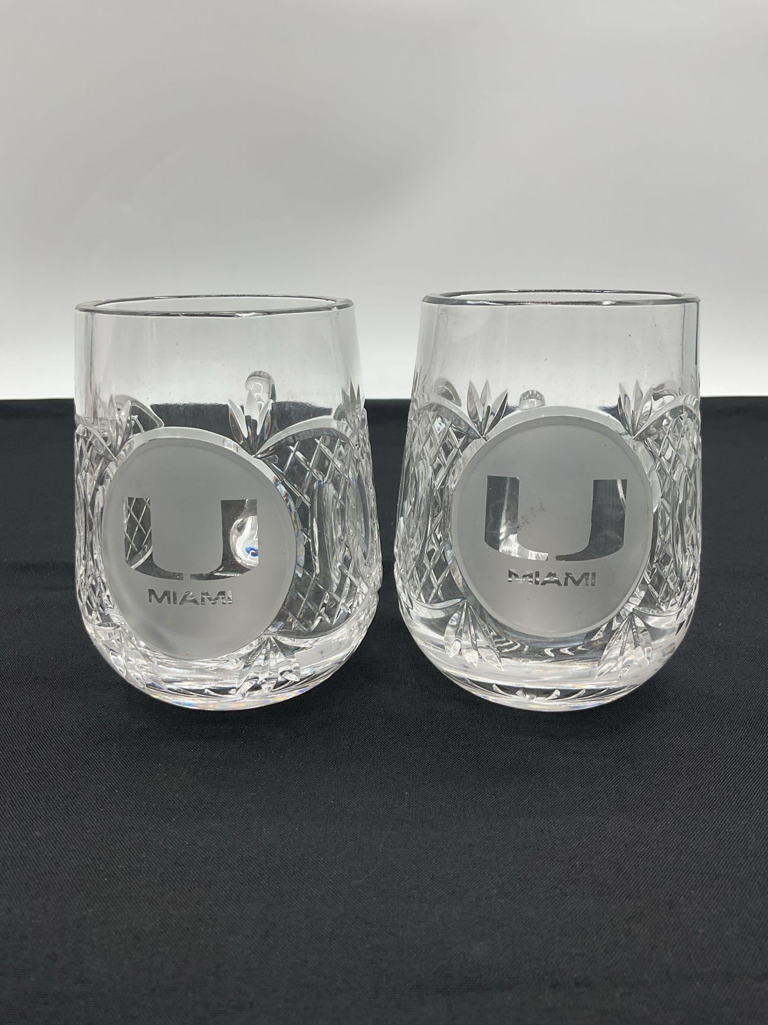 Vintage Cut Crystal Punch Cups (Set of 2): This set of two vintage cut crystal punch cups features an intricate design with a scalloped pattern and crosshatch cuts, giving them a refined, elegant look. These cups are often part of larger punch