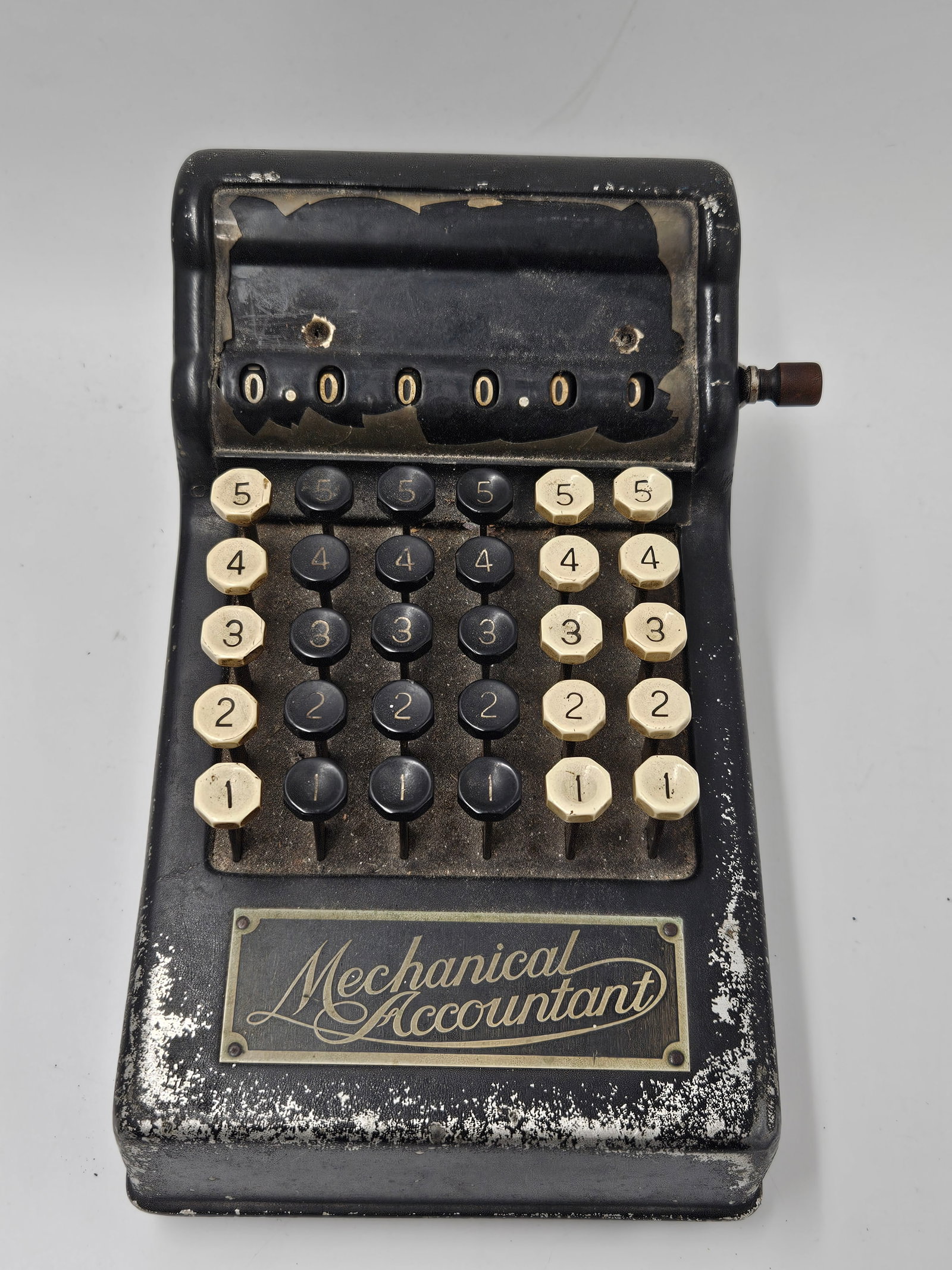 Vintage Burroughs Mechanical Accountant Calculator: Vintage 'Mechanical Accountant' calculator. Black metal case with off-white number keys. Shows wear consistent with age. A unique piece of calculating history.