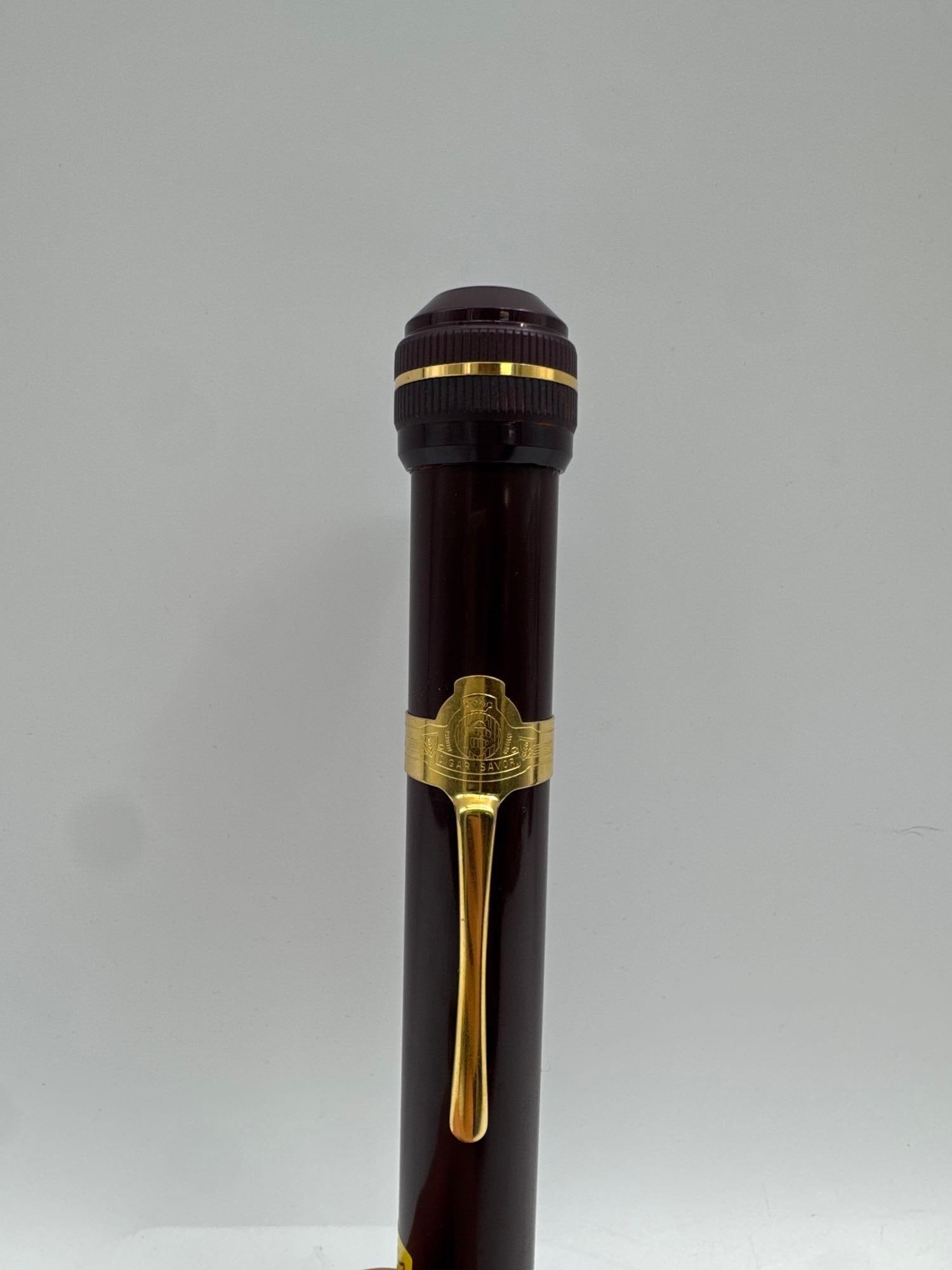 Luxury Cigar Saver Tube – Pen Style with Gold-Tone Trim: A stylish and functional cigar saver tube designed to look like a luxury fountain pen. Crafted in dark resin with gold-tone trim and pocket clip, this unique accessory discreetly holds and preserves a