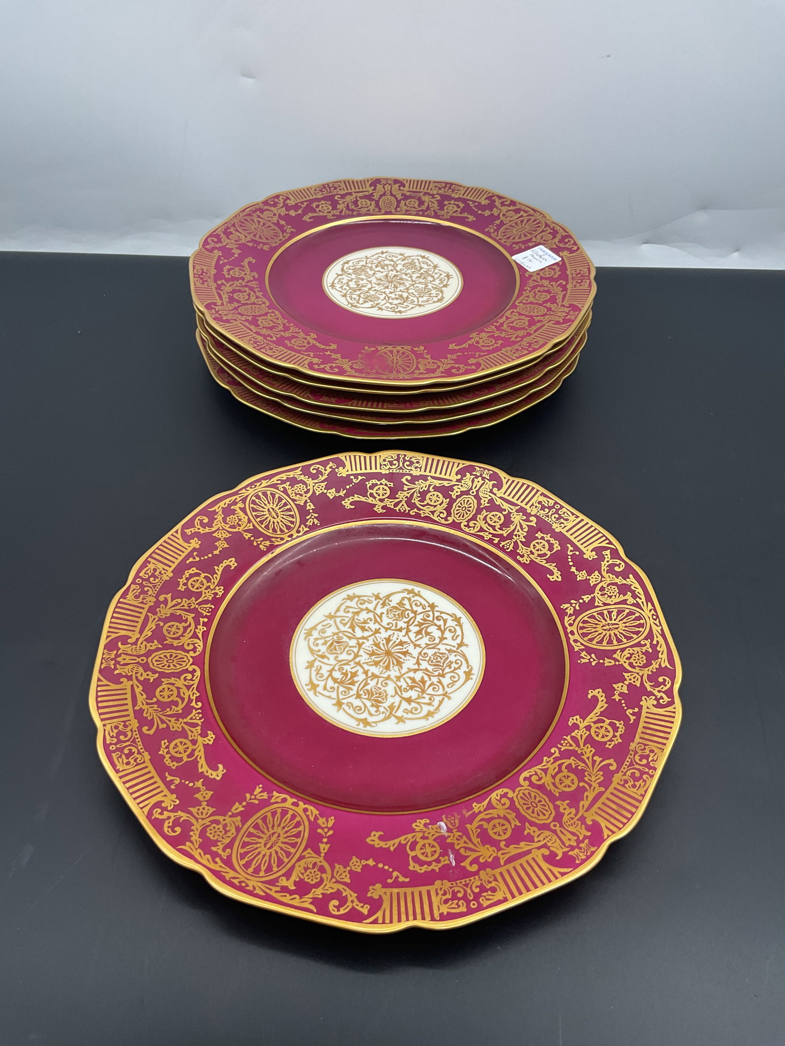 Set of 6 Krautheim & Adelberg Porcelain Plates: Set of six antique Krautheim & Adelberg porcelain plates. Each plate features a magenta center, gold floral design, and scalloped edge. Diameter: 11 inches.
