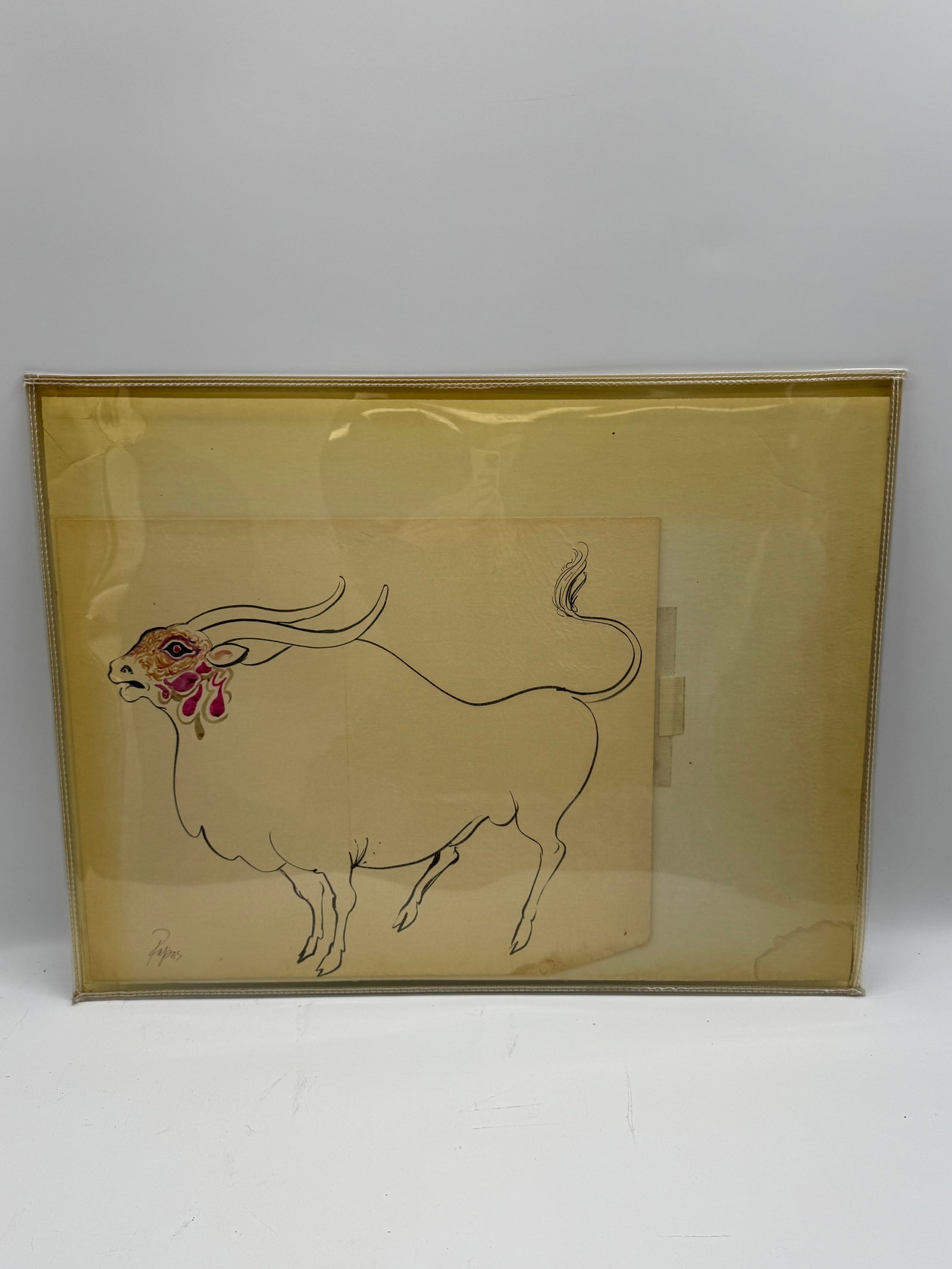 Framed Drawing of a Bull by Papas: Framed drawing of a bull, signed 'Papas' in the lower right. The drawing is executed in black ink with red and pink accents on the bull's face. Dimensions are 19 x 16 inches framed, and 27