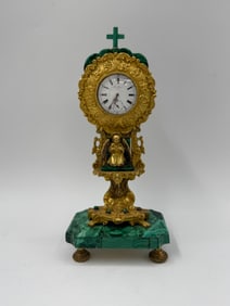 Malachite and Gilt Metal Figural Mantle Clock