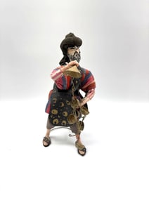 Handcrafted Figure of a Street Musician with Bells