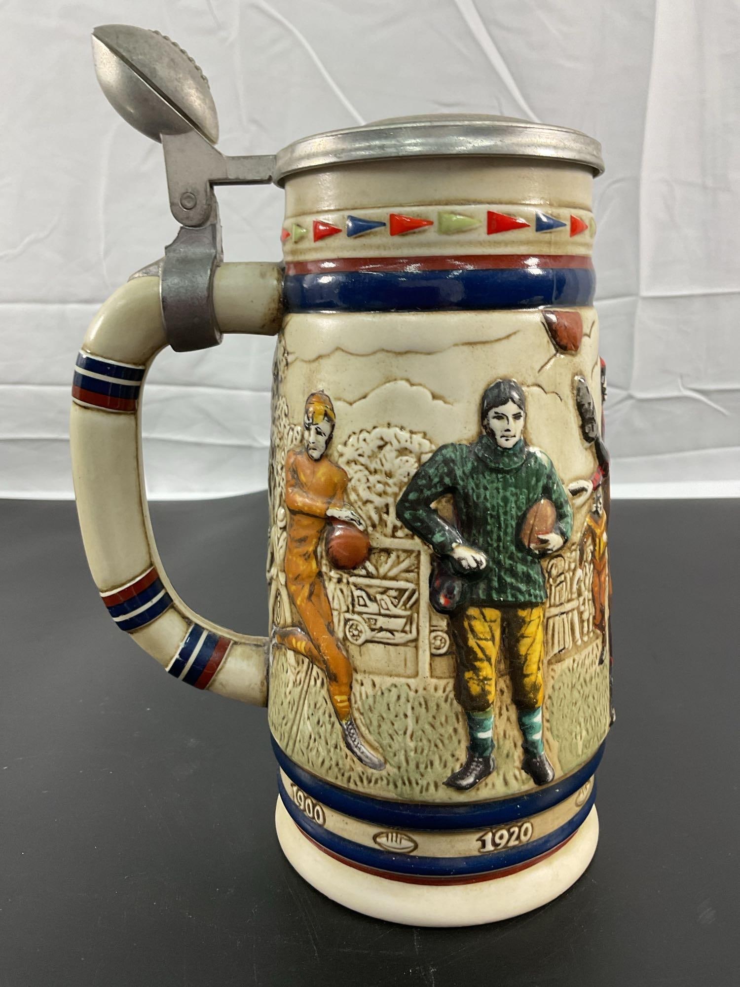 Avon NFL Collectible Stein (1983): This collectible stein, handcrafted in Brazil exclusively for Avon Products, Inc., features an NFL theme with detailed imagery of football players in action. The vibrant design showcases a player in a