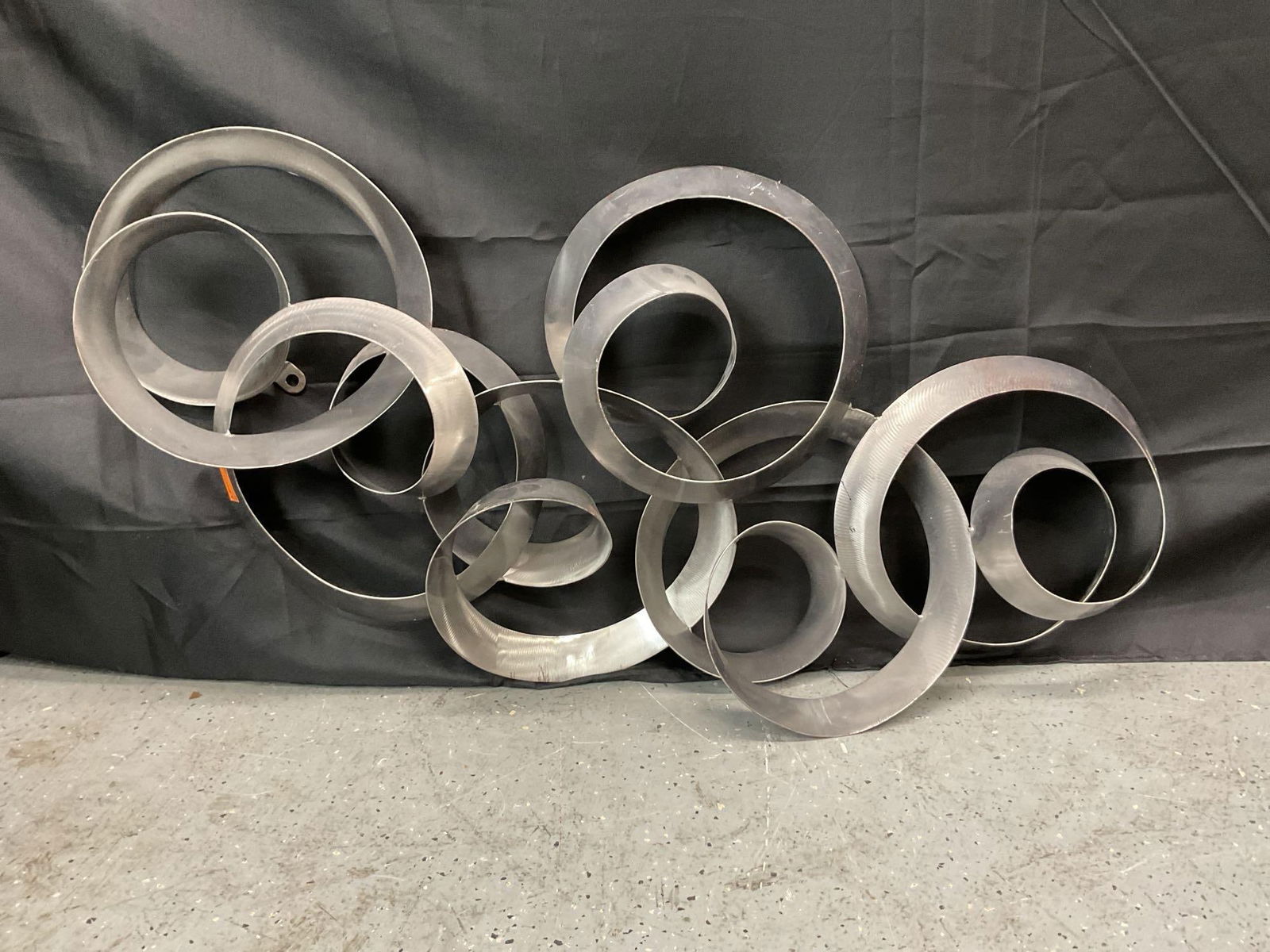 Modern Abstract Wall Sculpture with Interlocking Metal Rings (1 of 5)