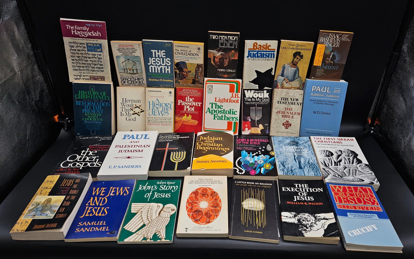 Religious and Historical Book Collection: Assorted lot of books on religion, Christianity, Judaism, biblical history, and theology. Includes titles such as The Family Haggadah, The Jesus Myth, The Passover Plot, Paul and Palestinian Judaism, 