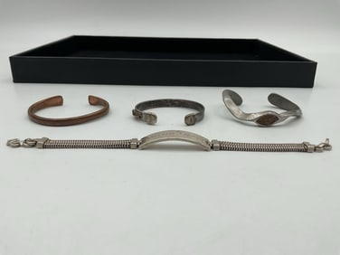 Group of 4 Mixed Metal Vintage Cuff and Bangle Bracelets Mixed metals including Copper and Silver