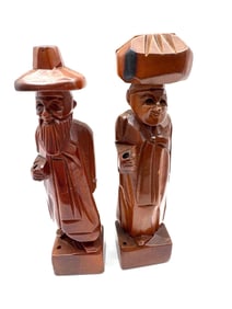 Pair of Hand-Carved Wooden Figures in Traditional Attire