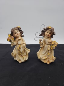 Pair of Matching Angel Figurines with Floral Garlands