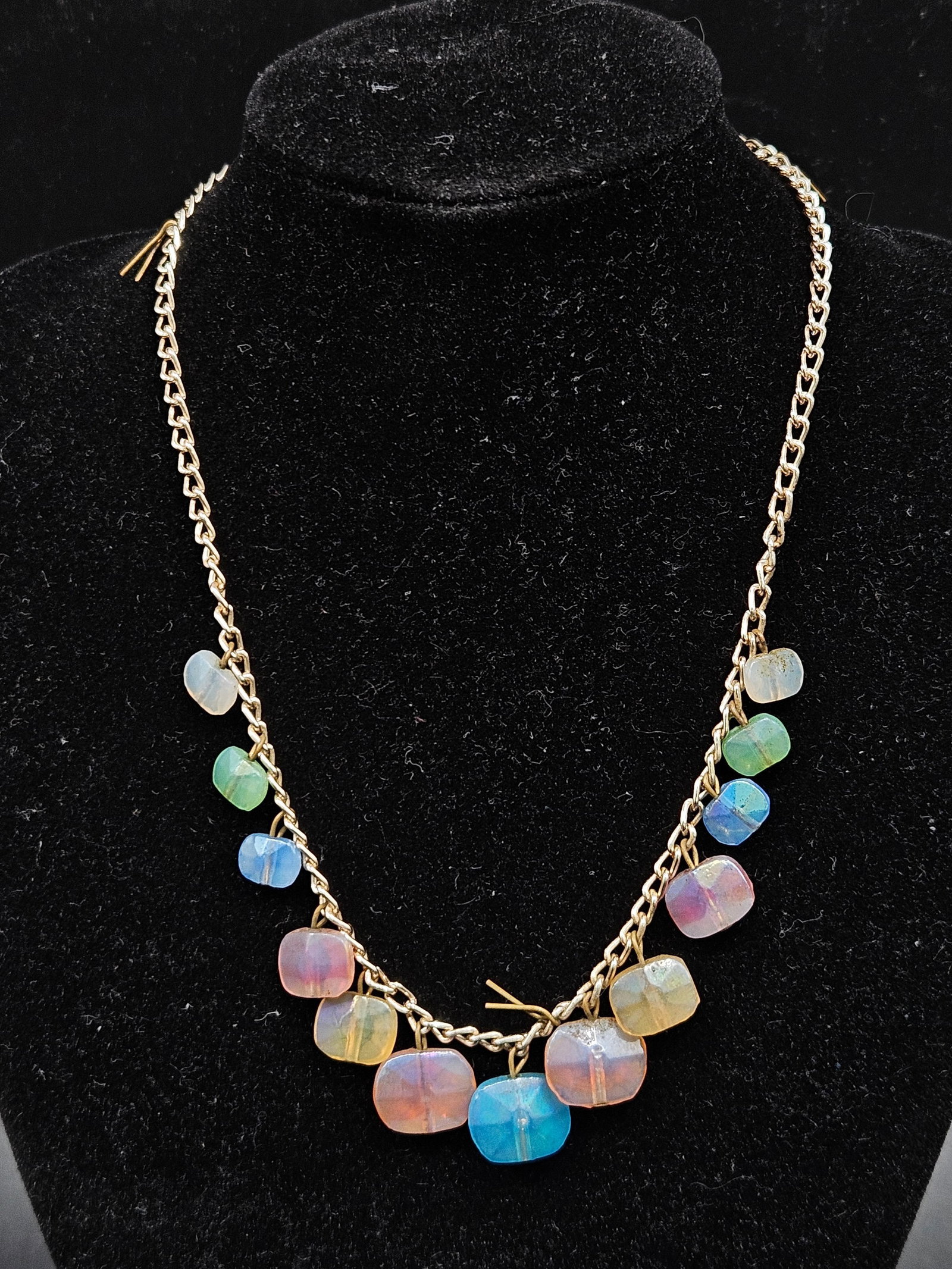 Colorful Bead Necklace: Vintage necklace marked Western Germany, featuring a gold-tone chain adorned with colorful faceted glass beads in pastel shades. A classic mid-20th century European costume jewelry piece. Medium Gold-