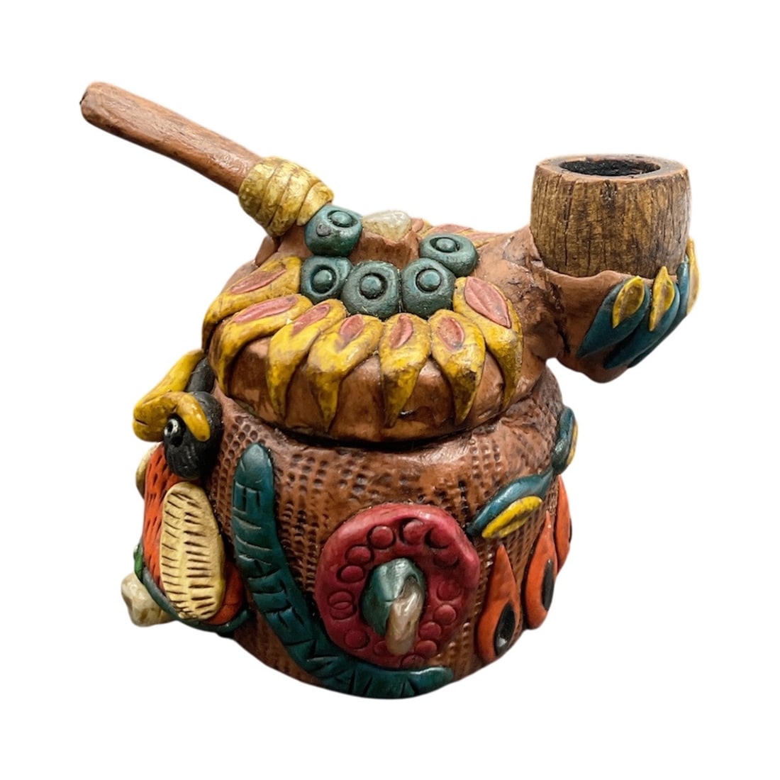 Colorful Tribal-Style Decorative Pipe: Hand-painted decorative piece crafted in the form of a pipe, featuring bold tribal-style motifs, feathers, and textured carving. While shaped like a pipe, it appears to be intended as a decorative ite