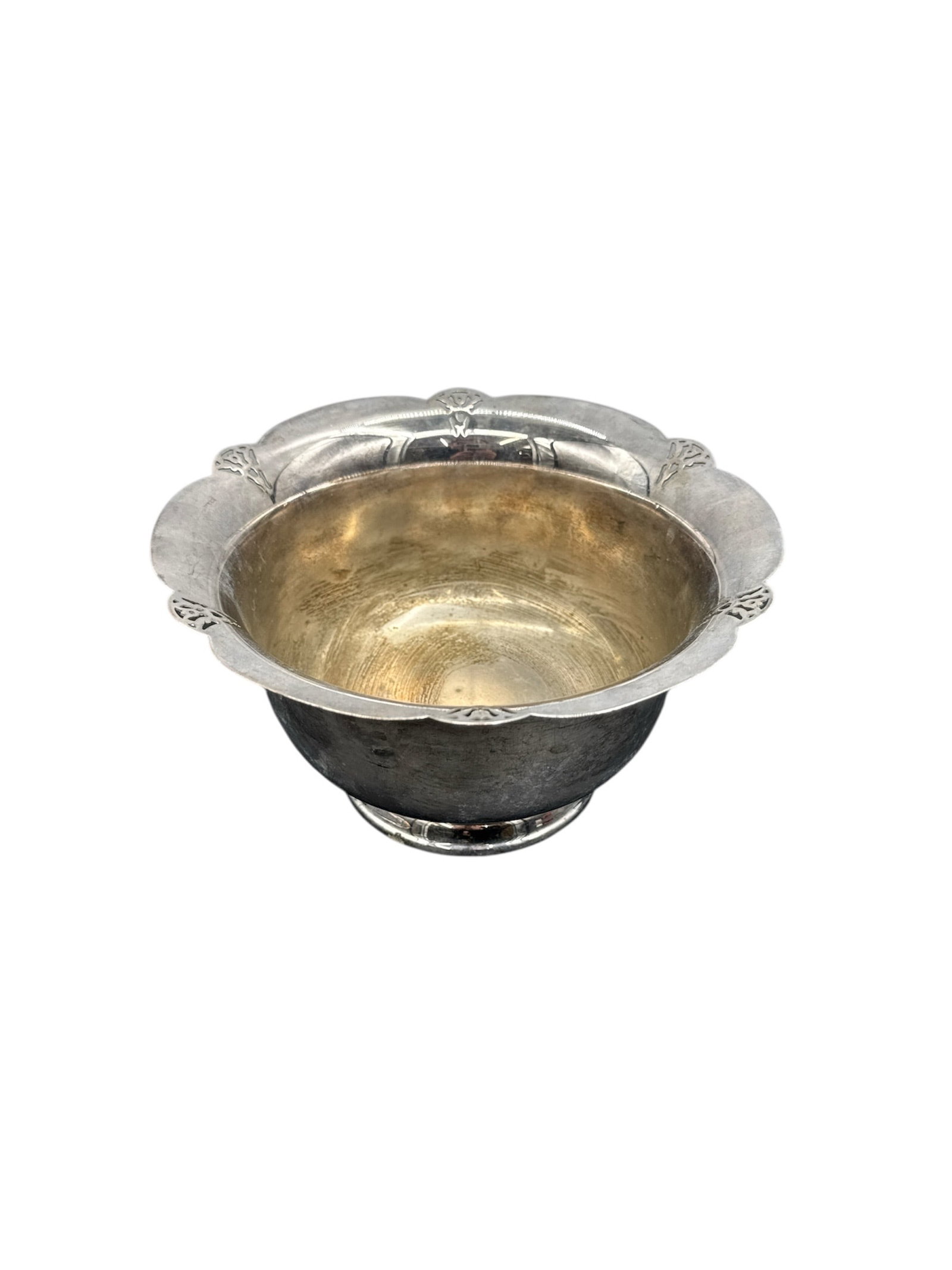 Silver Bowl with Floral Rim: A silver bowl featuring a decorative floral rim. Dimensions: 4 inches high, 8 inches wide.