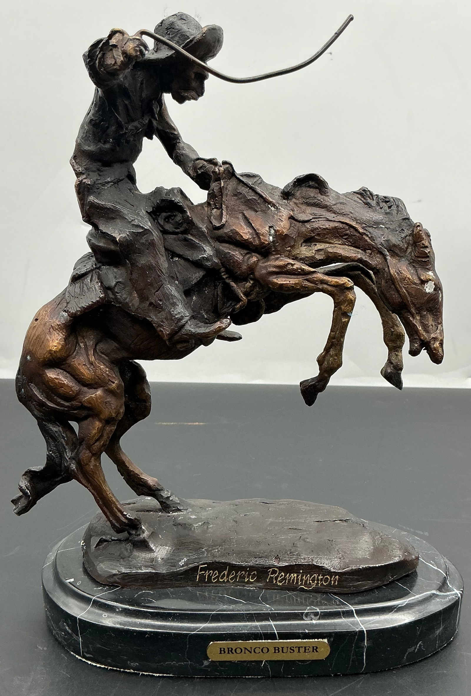 Bronze “Broncobuster: Small bronze version of a “Broncobuster” on marble base. Dimensions: H10in L7in W4in