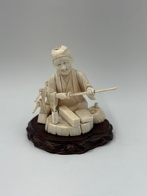 Japanese Okimono Carving of Man at Spinning Wheel