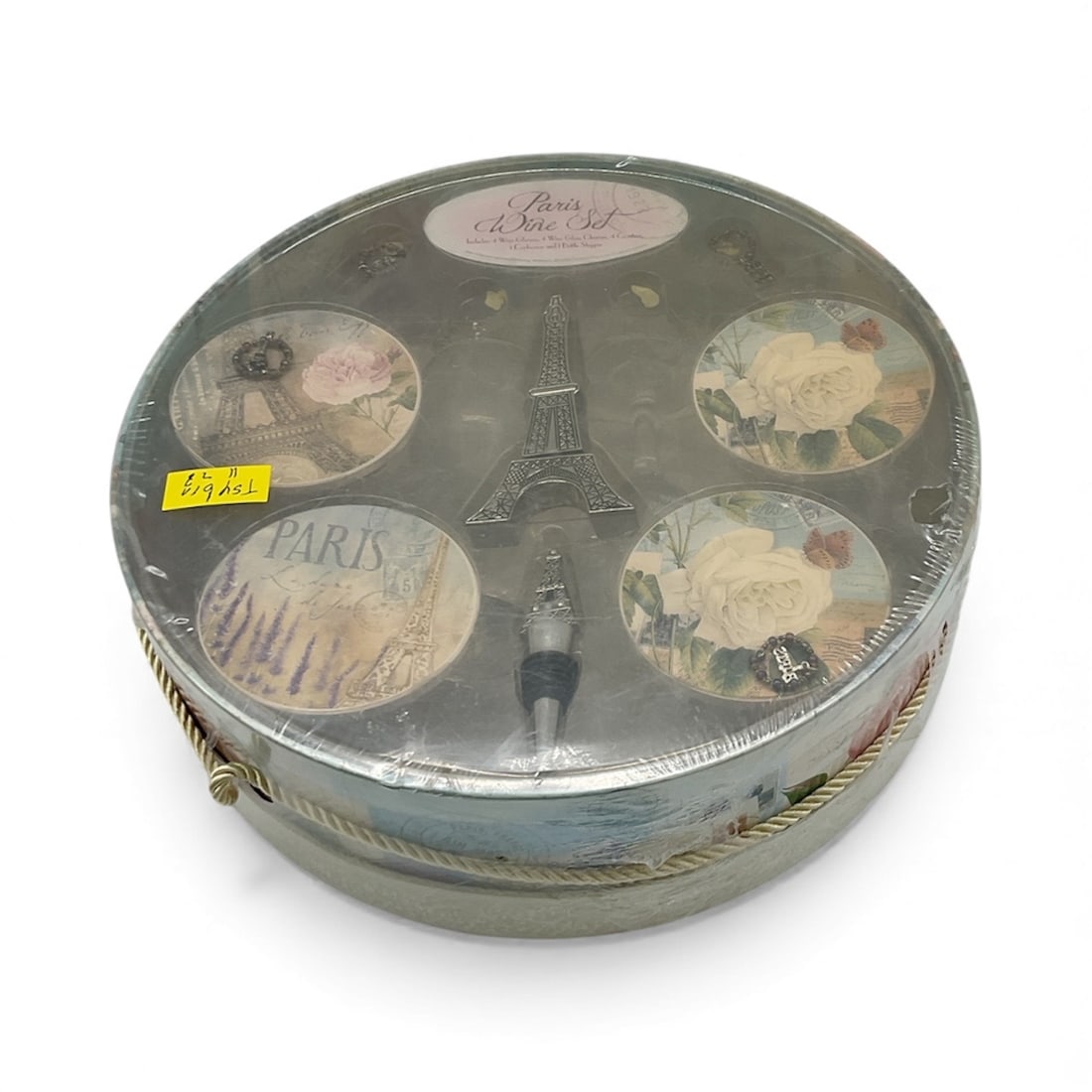 Paris Wine Set in Round Box: Paris Wine Set including 4 wine glasses, 4 wine glass charms, 4 coasters, 1 corkscrew and 1 bottle stopper. Set is housed in a decorative round box with rope handle.