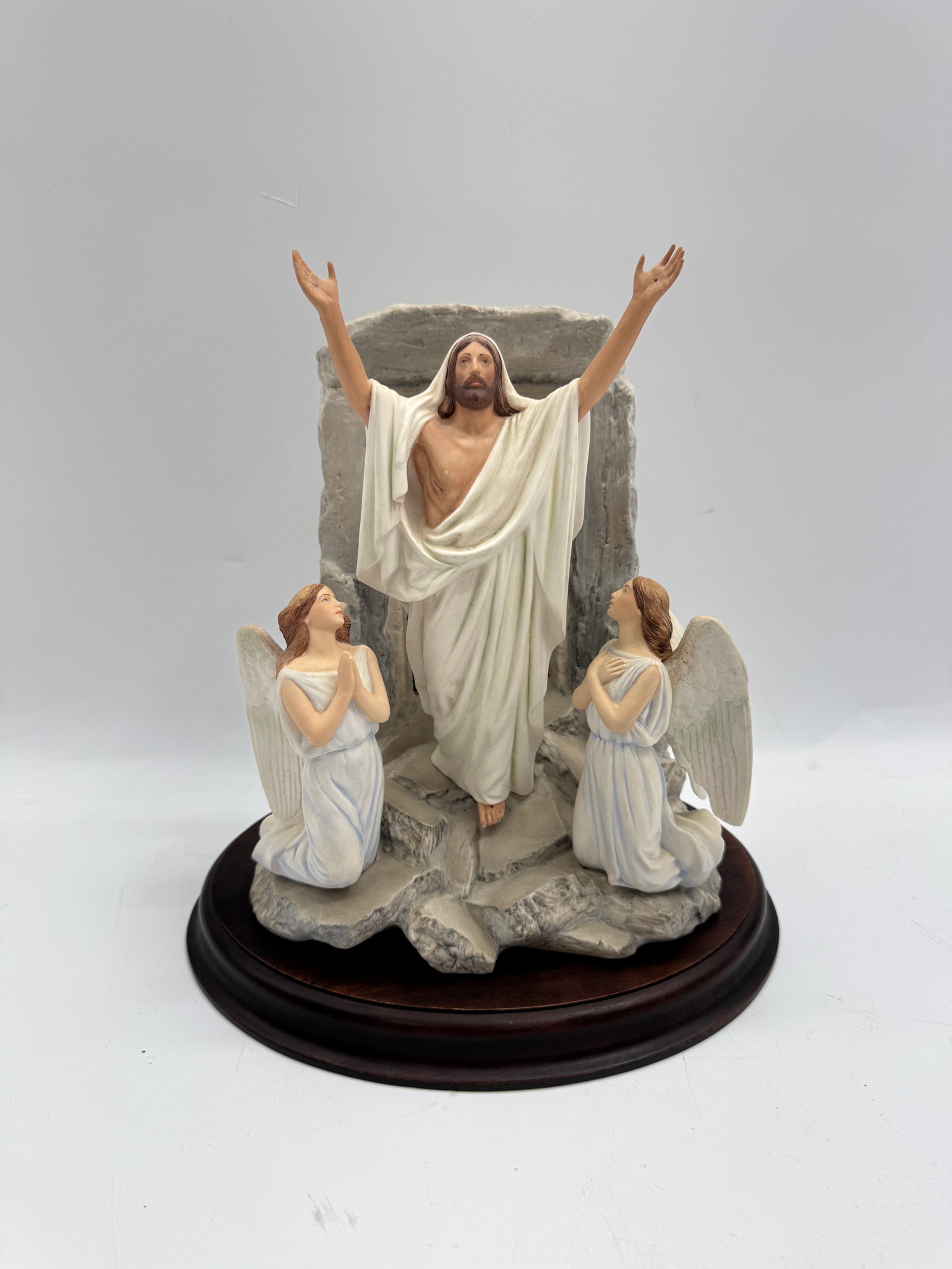 Resurrection Sculpture - Franklin Mint: Resin sculpture depicting the Resurrection. Features Jesus Christ with angels, mounted on a wooden base. Dimensions: 10 x 6 x 10 inches.