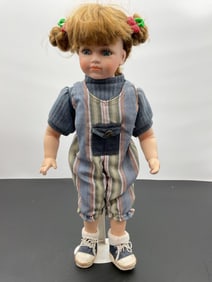 Porcelain Doll in Striped Overalls with Pigtails