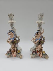 Pair of Porcelain Cherub Figural Candlesticks