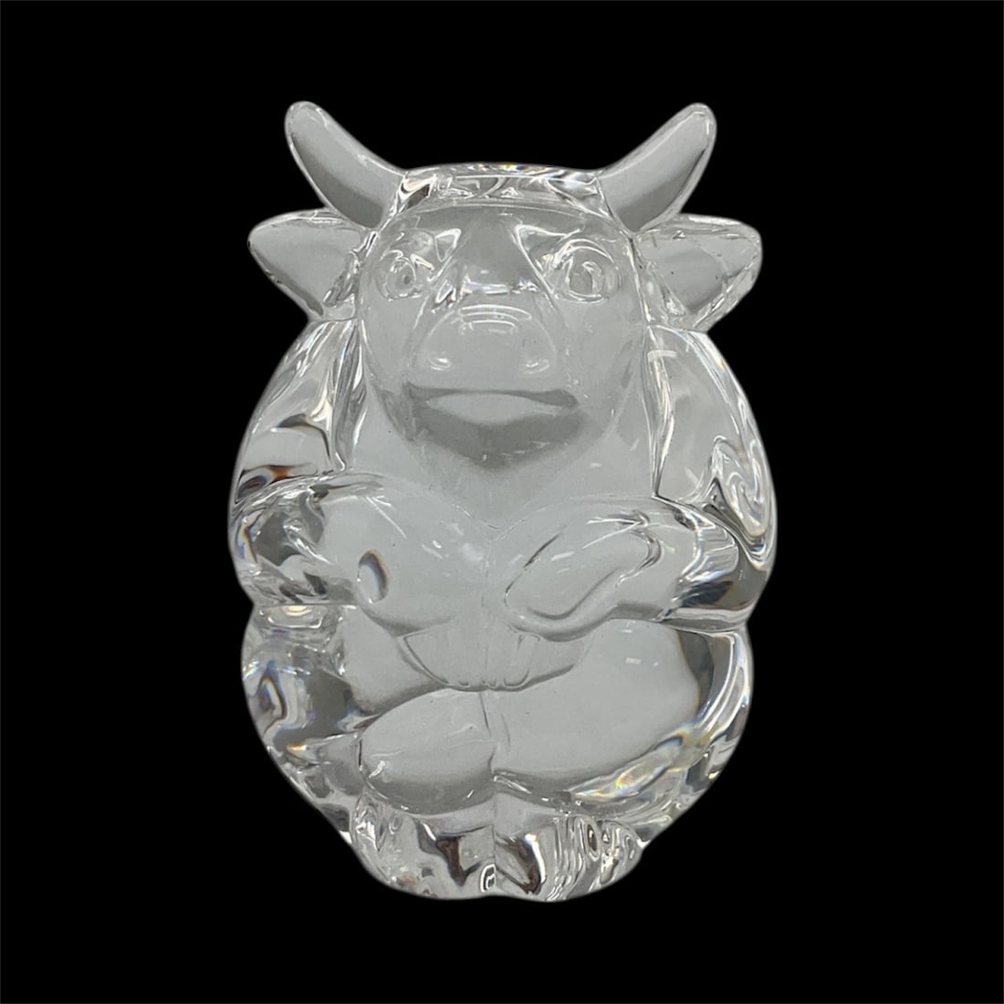 Steuben Crystal Bull Hand Cooler / Paperweight: Solid crystal paperweight by Steuben depicting a stylized bull with rounded, sculptural contours. Known for exceptional clarity and refined craftsmanship, this piece reflects Steuben’s signature