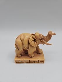 Carved Elephant Figurine on Base