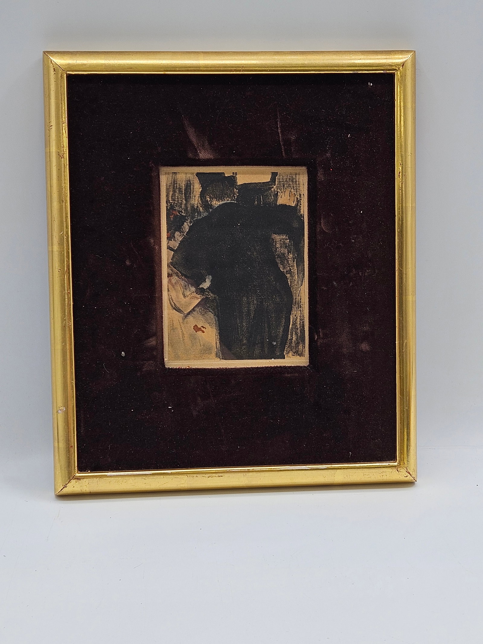 Abstract Expressionist Painting: Abstract expressionist painting featuring bold black brushstrokes on a light ground. Framed with a gold-tone frame and set against a dark velvet backing. Signed on the front. Dimensions: H 14 1/2: in&
