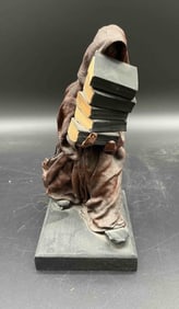 Hooded Figure Carrying Books