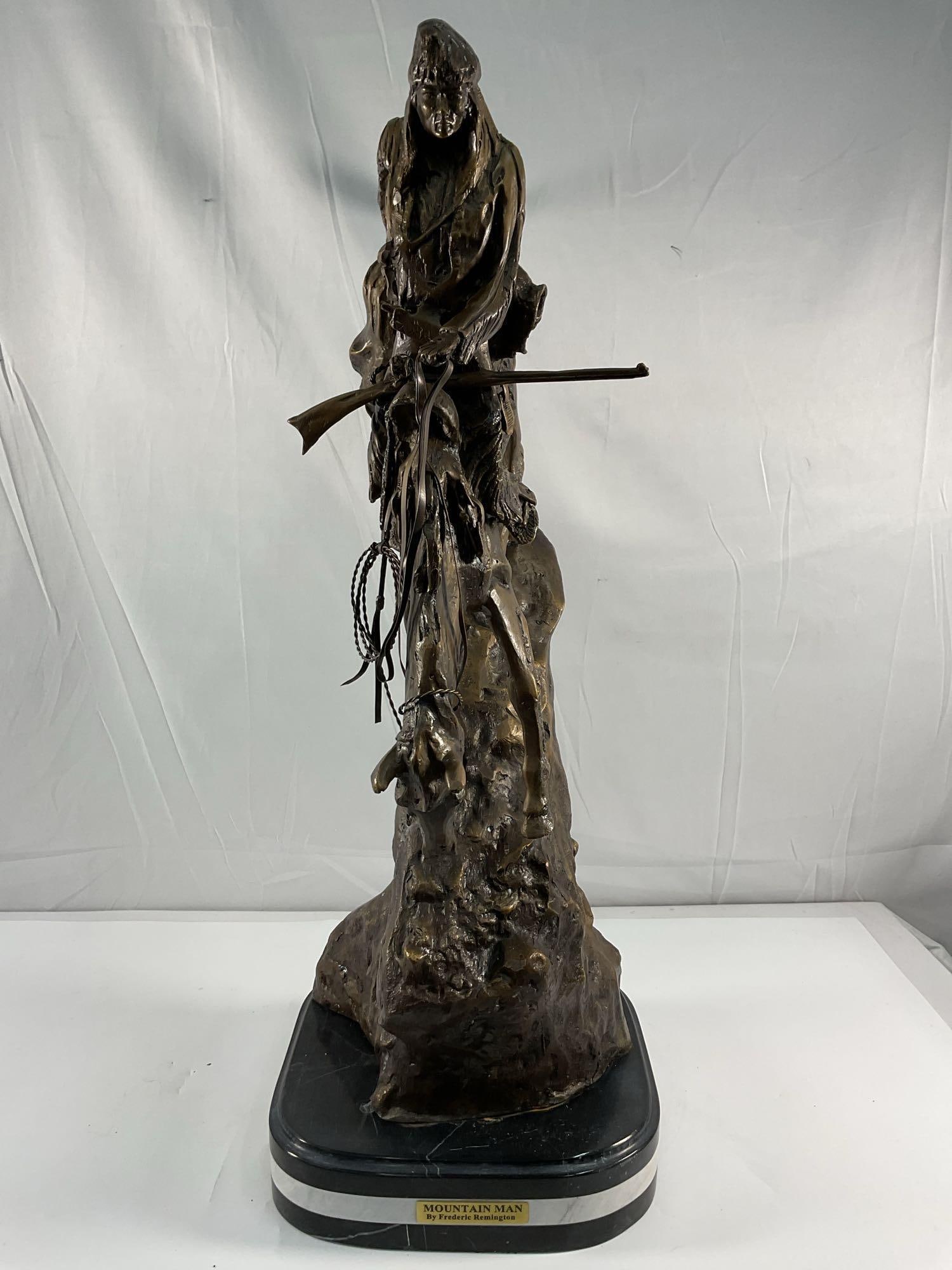Frederic Remington Bronze - Mountain Man Sculpture: A finely cast with epic details in this monumental sized sculpture after Frederic Remington (Am. 1861-1909), titled Mountain Man, bronze recast sculpture on green marble base. Depicting a mountain man